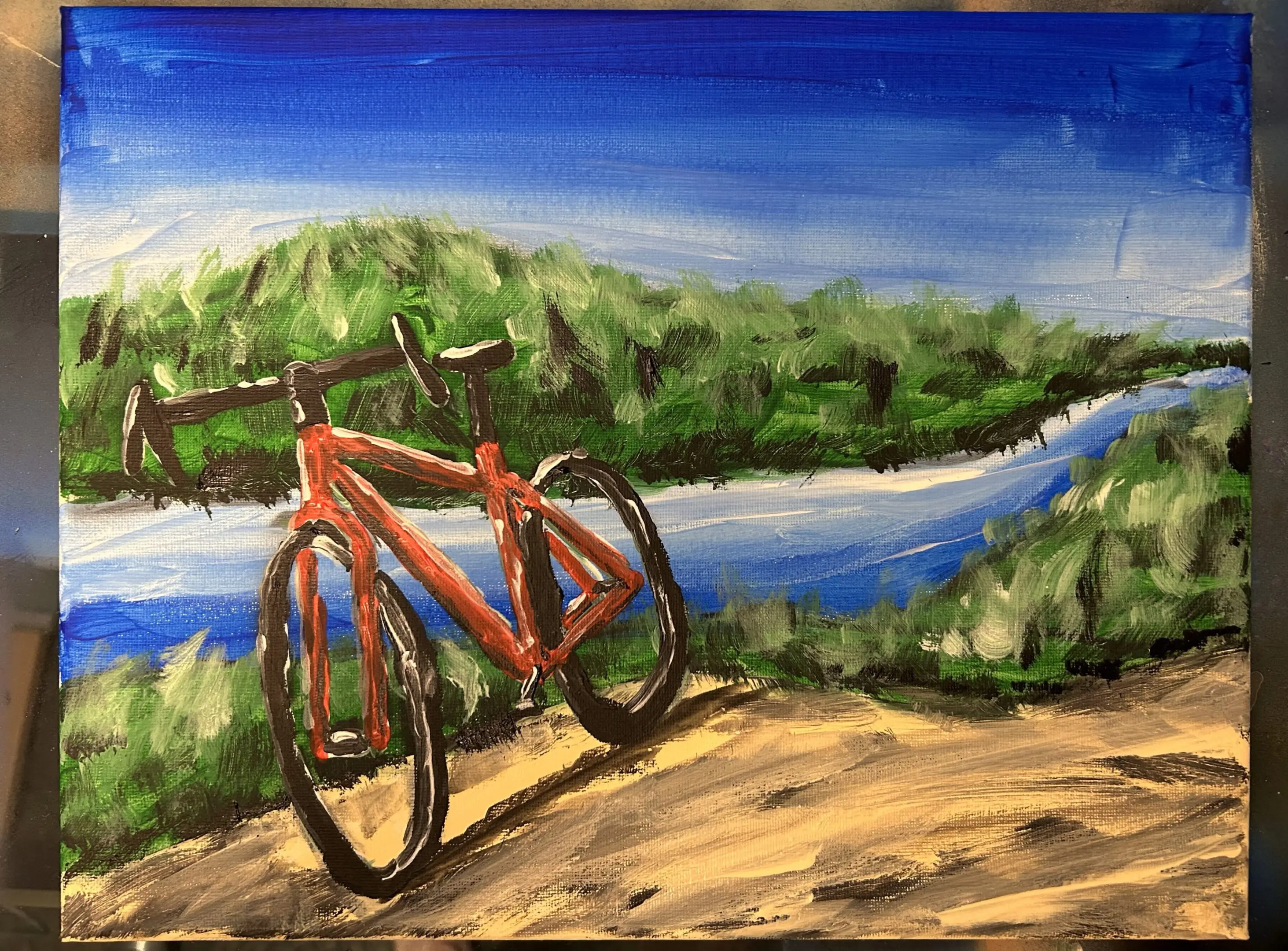 A painting of a bicycle on the side of a river.