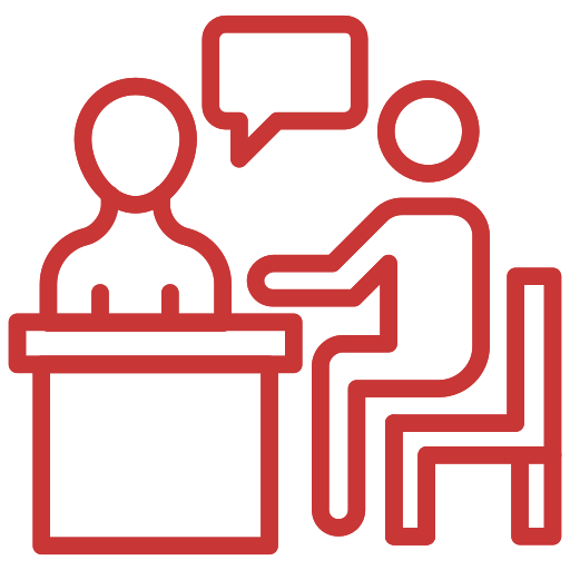 Two outlined figures in red, one seated at a desk and the other seated with a speech bubble overhead, suggesting a conversation or interview setting.