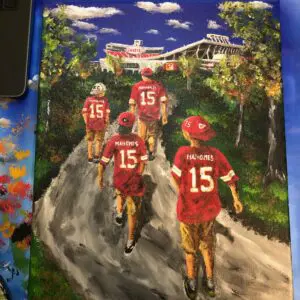 A painting of the kansas city chiefs on a dirt road.